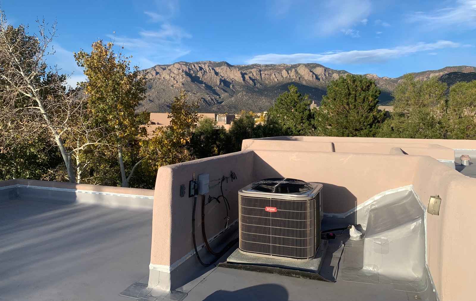 Air Dynamics of Tulsa owners Pat and Stephen, standing in front of their truck smiling.