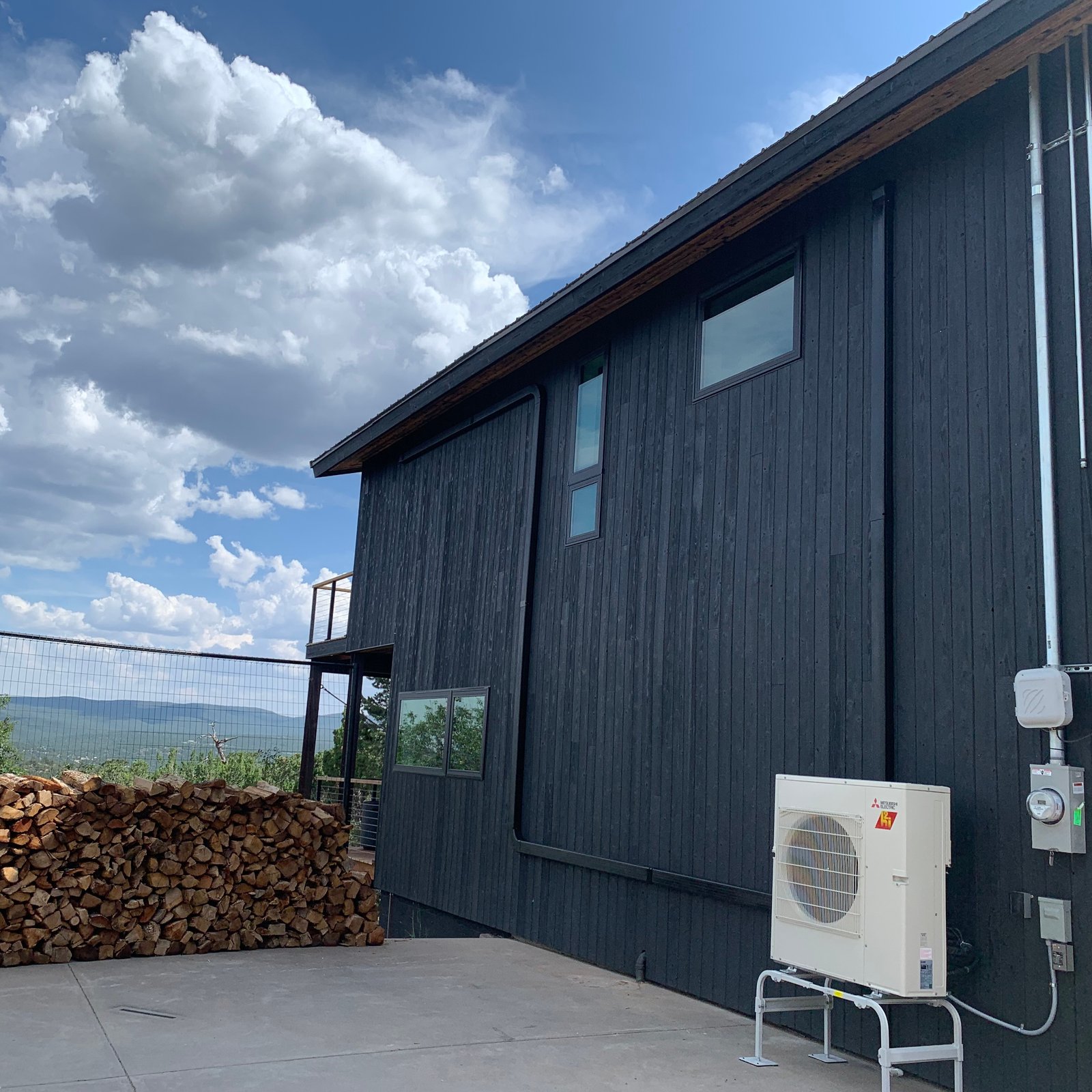 Air Dynamics of Tulsa HVAC Technician performing repair work.